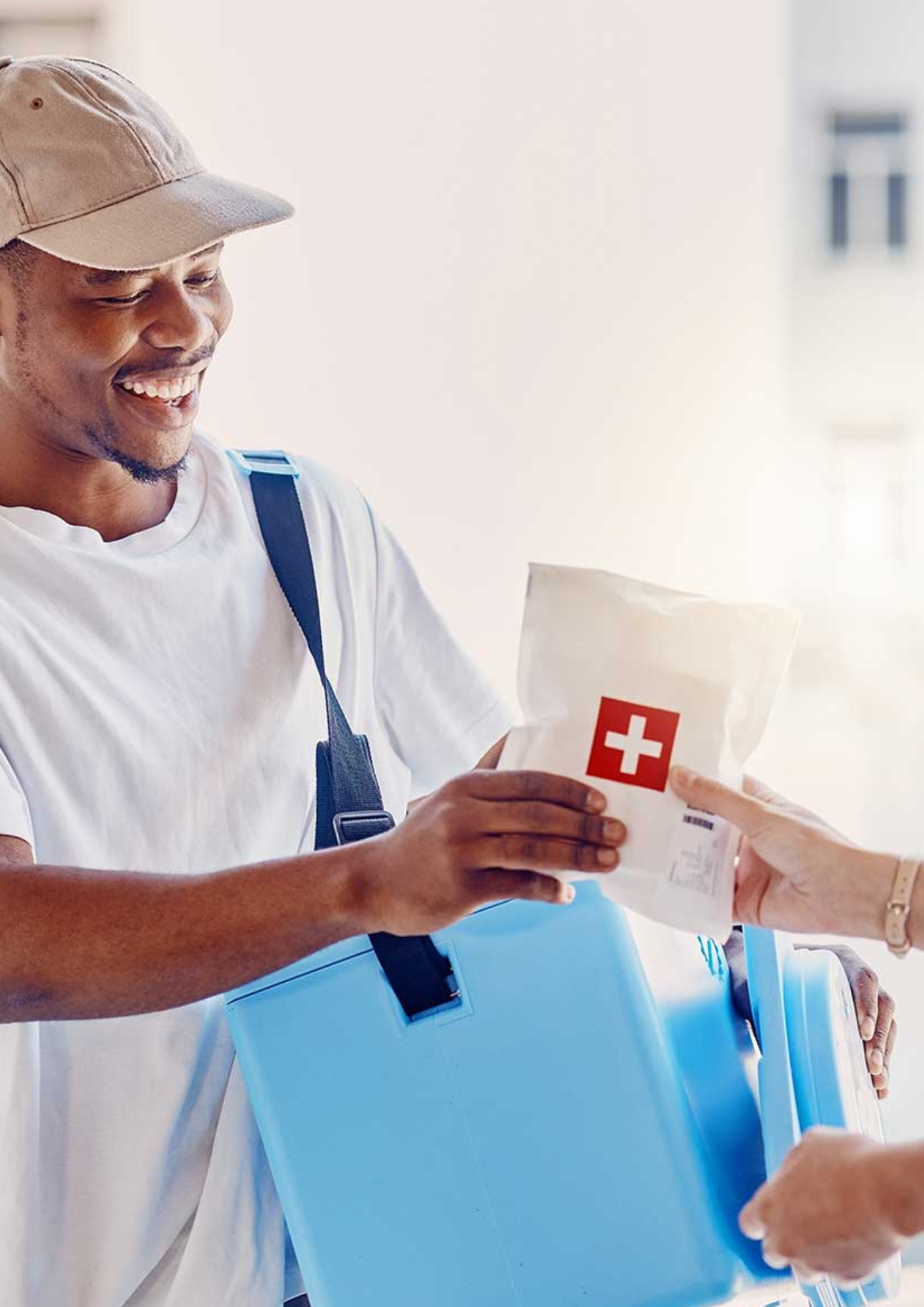 Medical courier loading approved materials for transport between healthcare facilities
